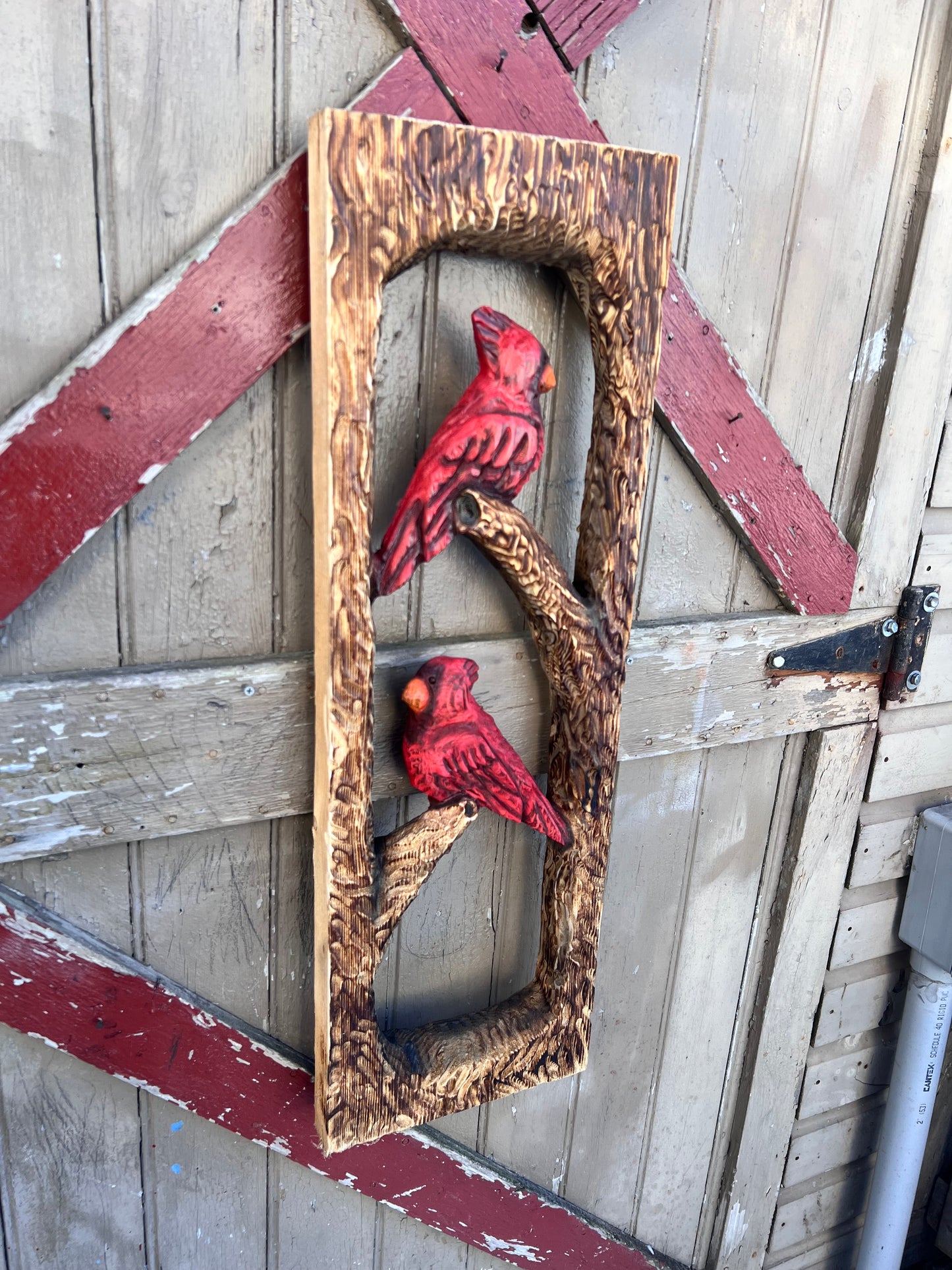 Chainsaw carved cardinals . Rustic Wall decor