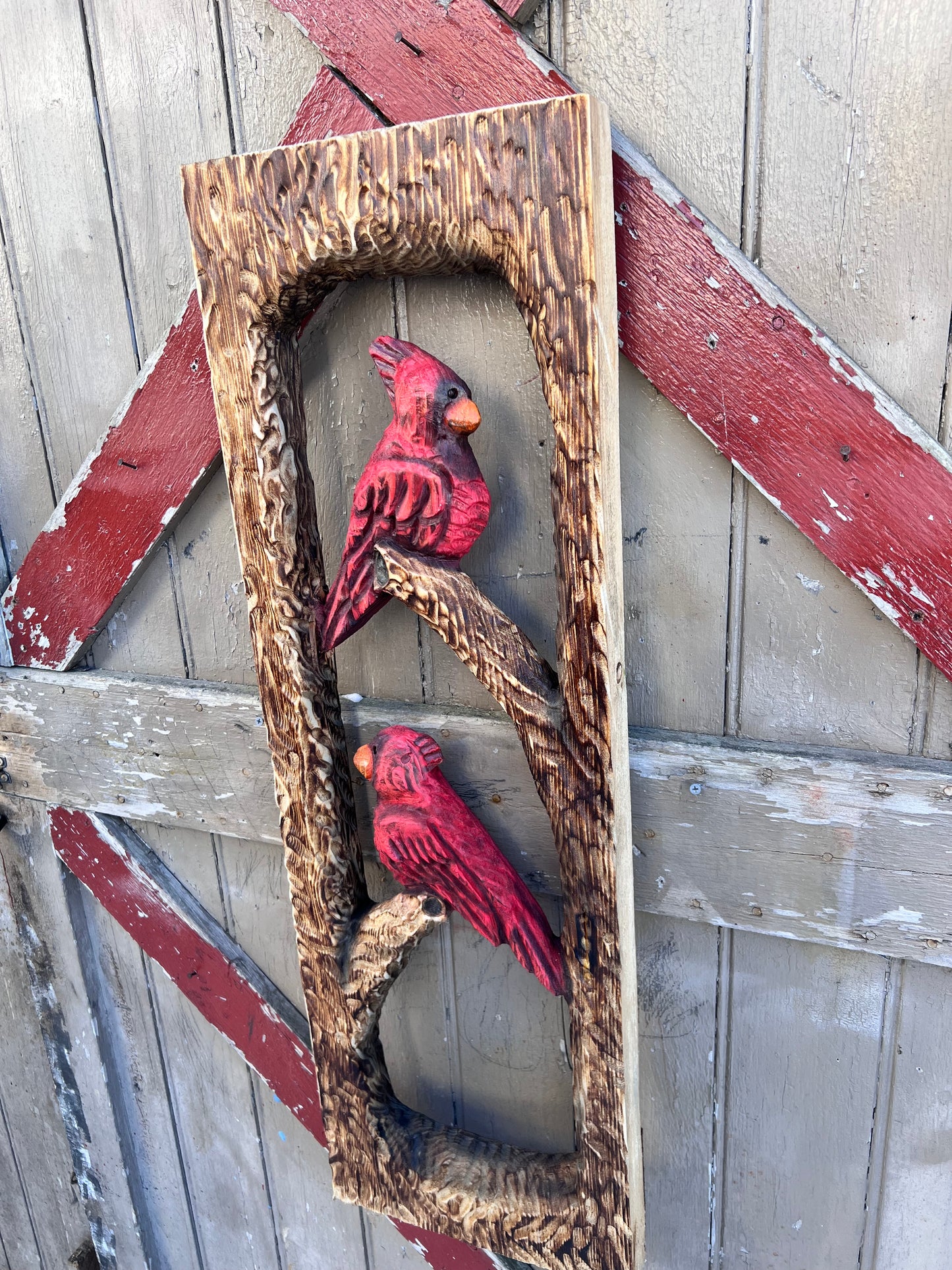 Chainsaw carved cardinals . Rustic Wall decor